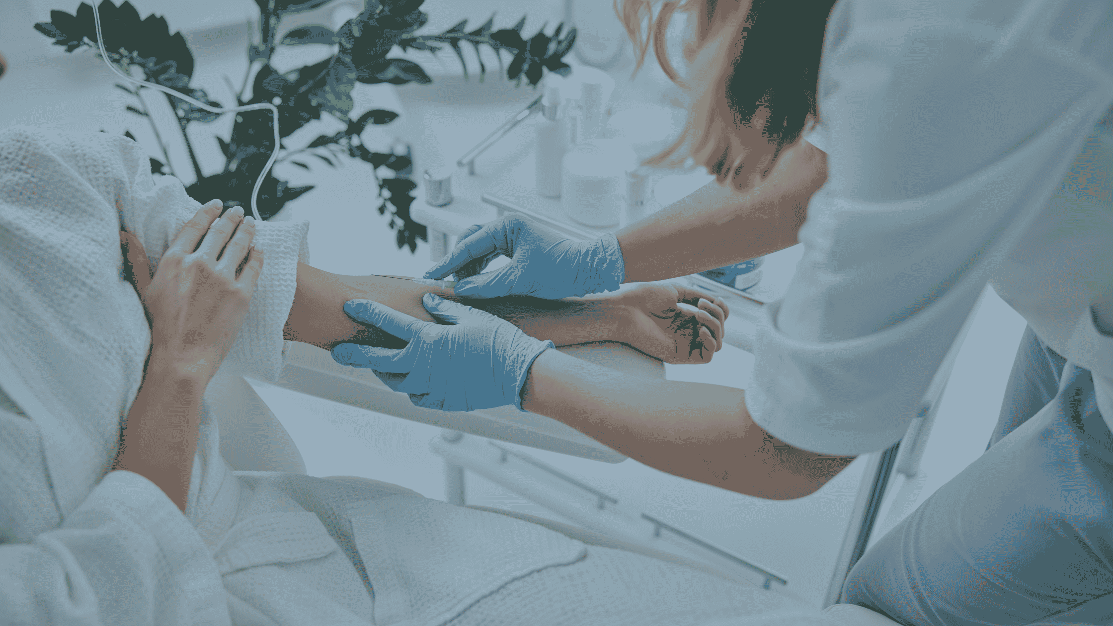 Healthcare professional providing mobile IV therapy to a patient at home
