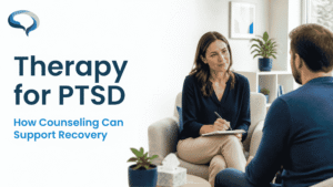 Mental health professional discussing PTSD therapy and counseling with an adult patient.